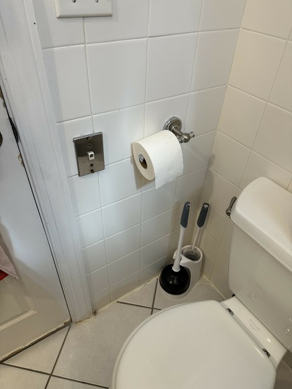 phone or Ethernet port next to the toilet paper in the bathroom