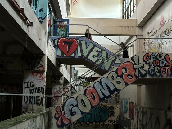 staircases in the abandoned middle school with honestly beautiful tags 

also IG KILLED URBEX sprayed on a wall which, yeah, def