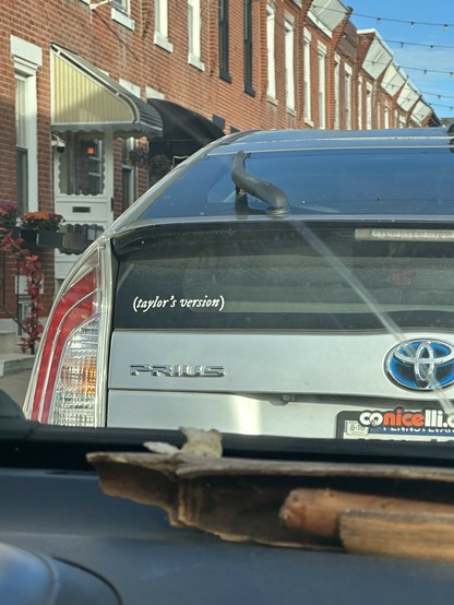 Prius with a sticker that says (taylor's version)