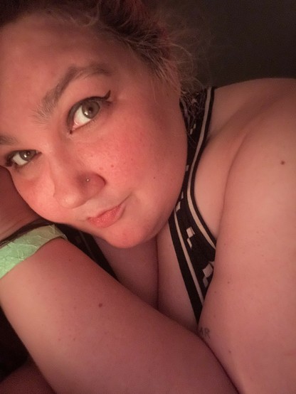 selfie of my dumb red face laying in the dark bc idfk what to do with myself bc everything feels pretty overwhelming but also it's only 7pm