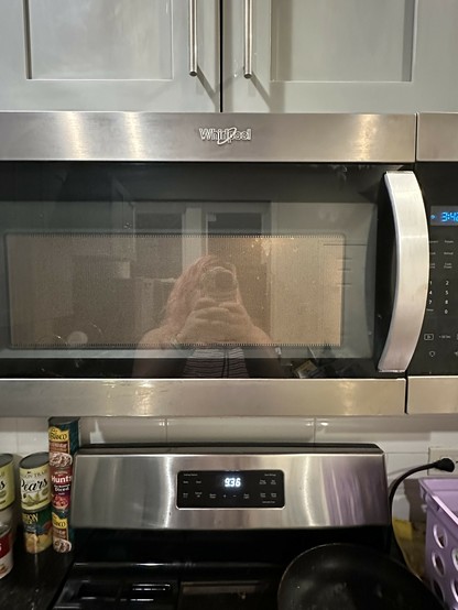 my reflection in the microwave while i heat up food