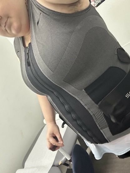 me in my back brace that fully zips up the front and has all kinds of scientific looking panels on it