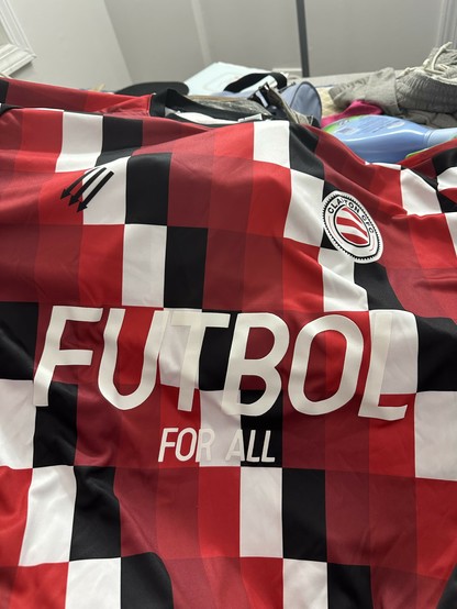 front of my Clapton CFC home kit which now has a big white FUTBOL FOR ALL decal