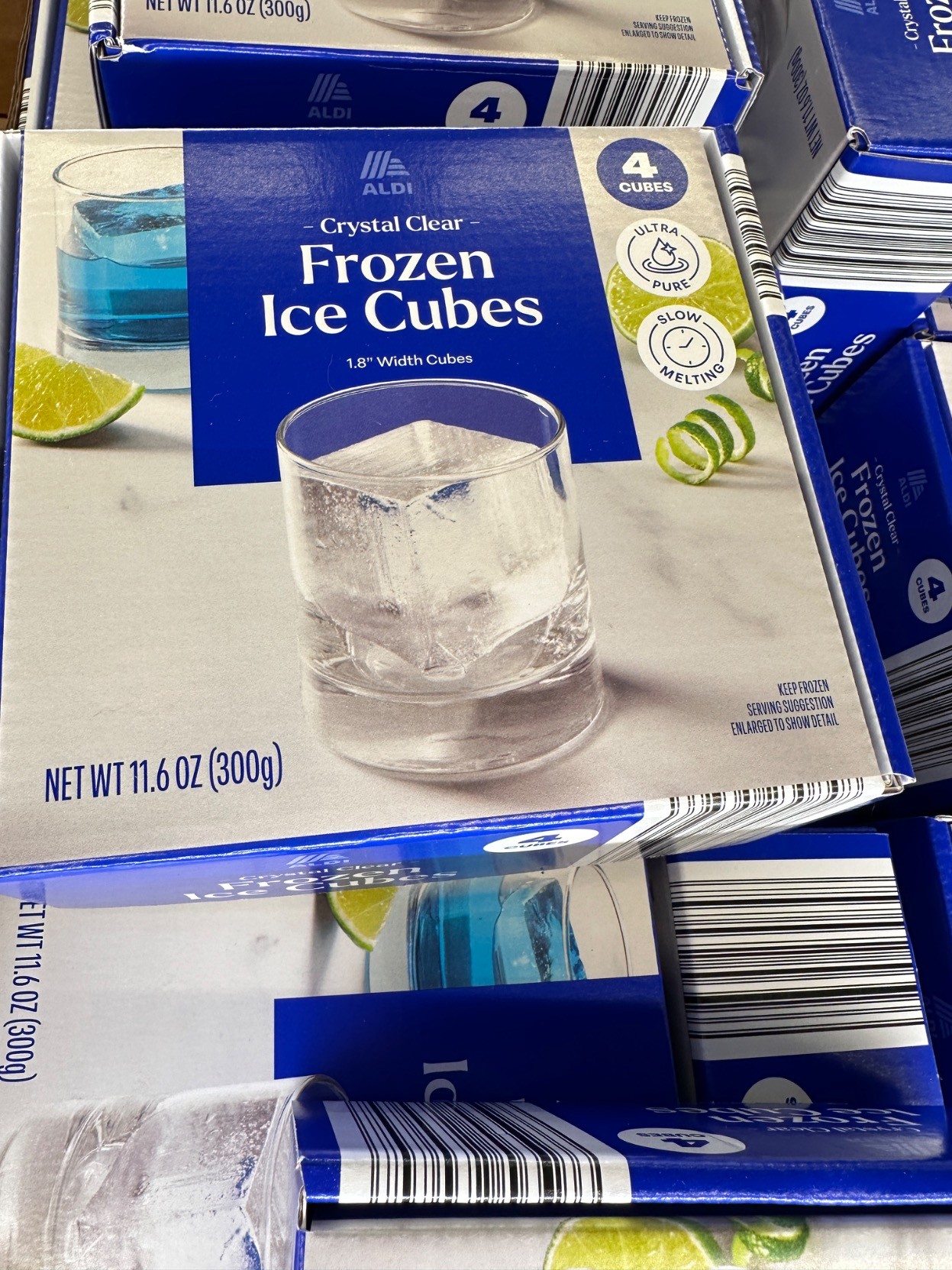 boxes and boxes of frozen ice cubes

300g

"aldi crystal clear frozen ice cubes"
"1.8" width cubes"
"4 cubes" "ultra pure" "slow melting"
"keep frozen"
"serving suggestion"
"enlarged to show dettail"